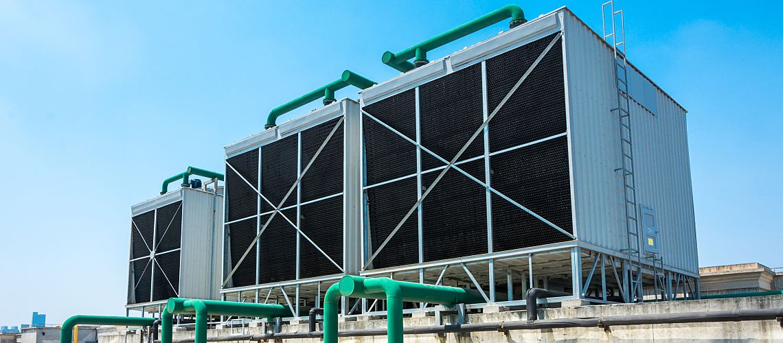 Cooling towers against a blue sky.