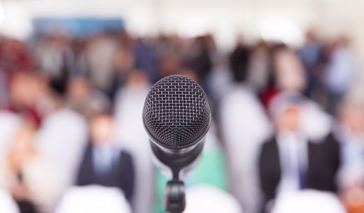 Microphone in front of a conference session.