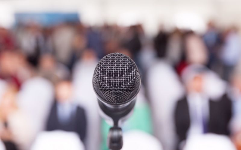 Microphone in front of a conference session.