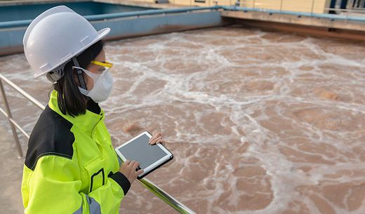 An environmental engineer oversees a water recycling system.