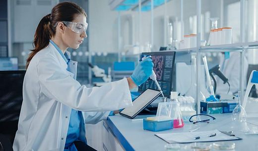 A lab worker analyzes samples.