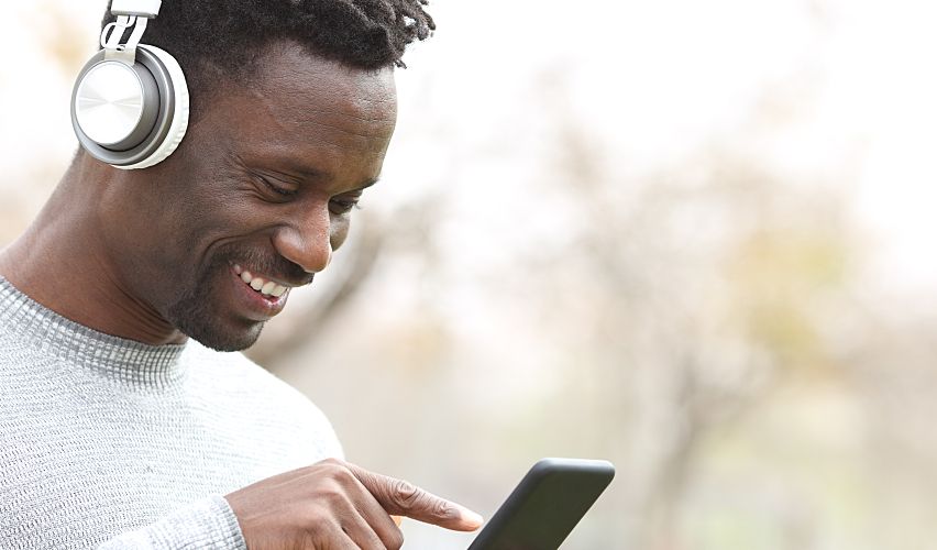 Man with headphones and a phone.