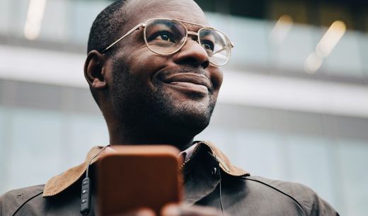 Businessman having just checked email on his phone.