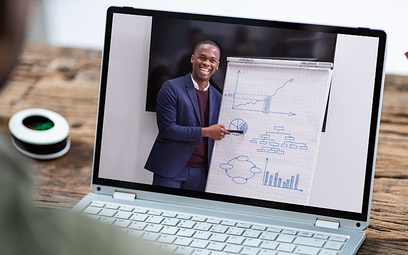 A man presents at a virtual conference.