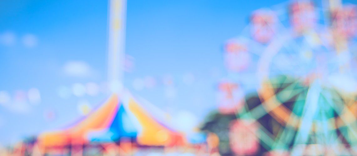 Fairground with ferris wheel and carousel.