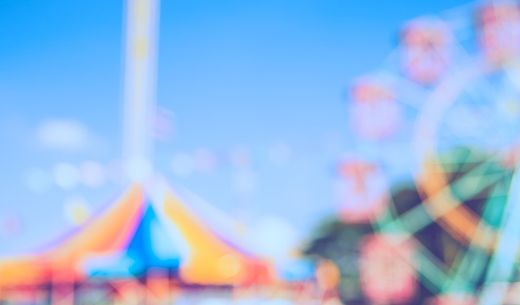 Fairground with ferris wheel and carousel.