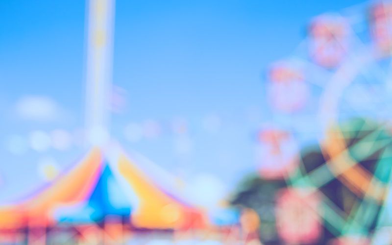 Fairground with ferris wheel and carousel.