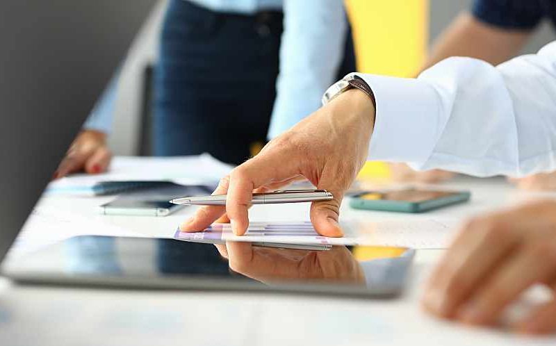 Manager reviews documents in an office.