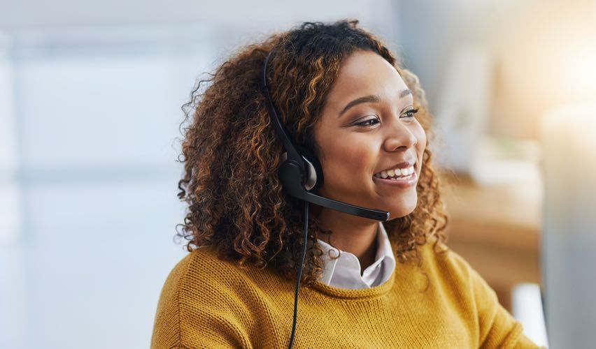 Customer service representative on the phone with a customer at a water lab.
