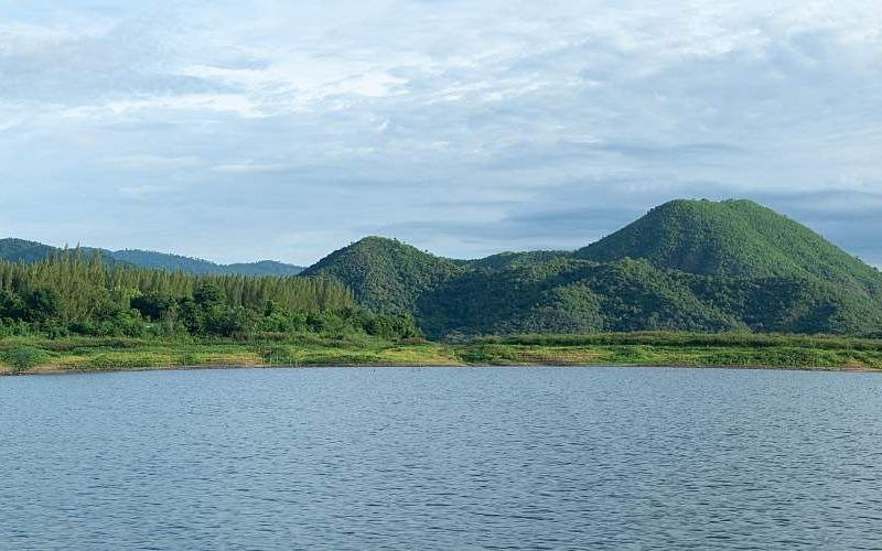 A reservoir viewpoint with mountains in the background.