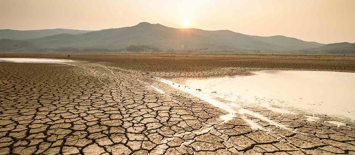 A drying lake illustrates seasonal drought.