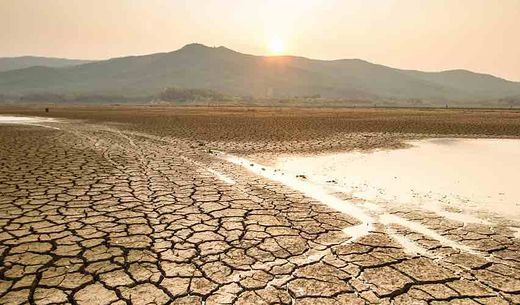 A drying lake illustrates seasonal drought.