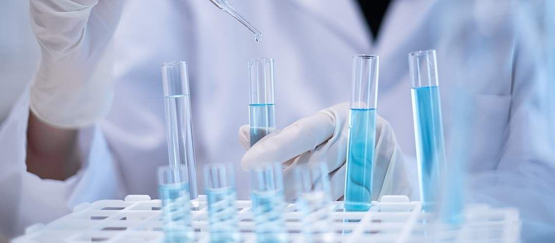 A researcher uses a pipette to test water.