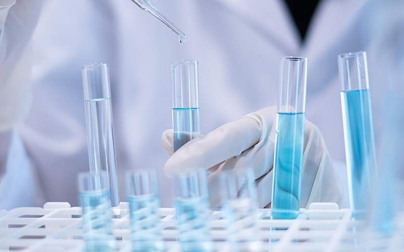 A researcher uses a pipette to test water.