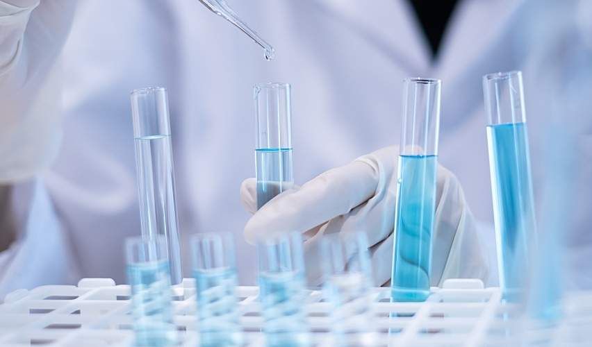 A researcher uses a pipette to test water.