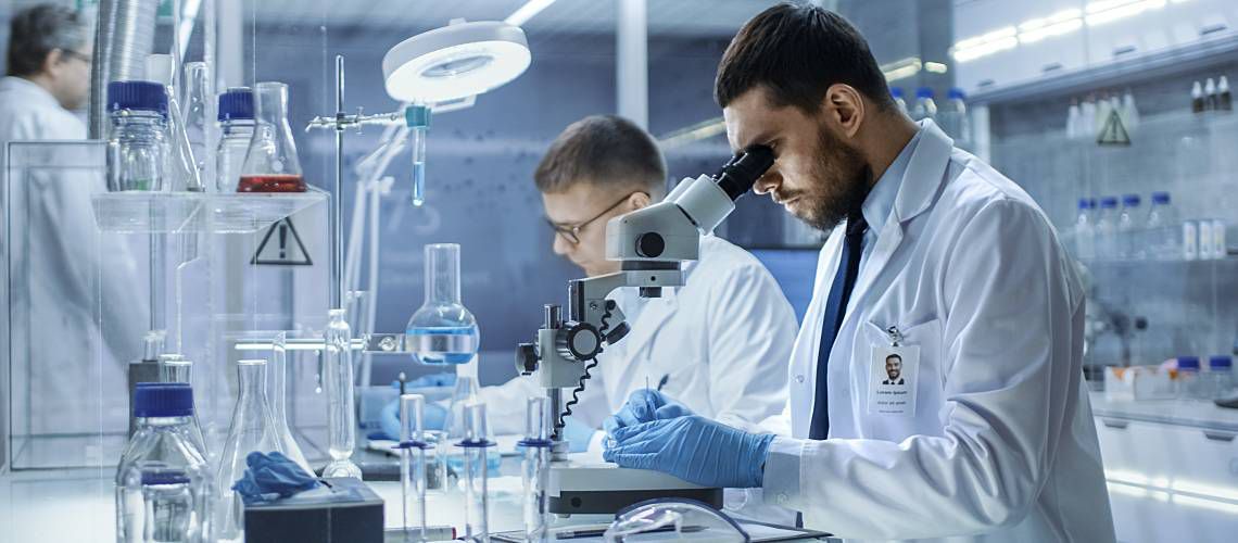 Scientist working at the bench in a laboratory.