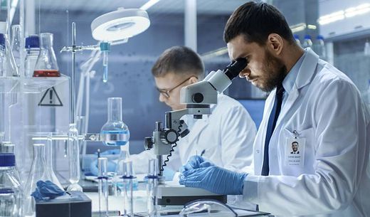 Scientist working at the bench in a laboratory.