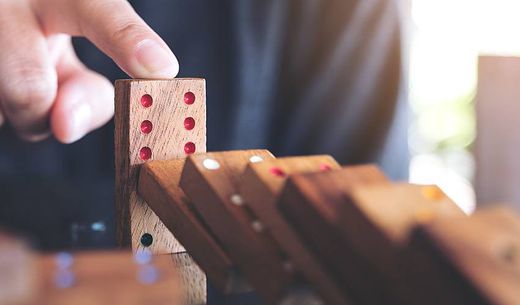 Person playing dominoes.