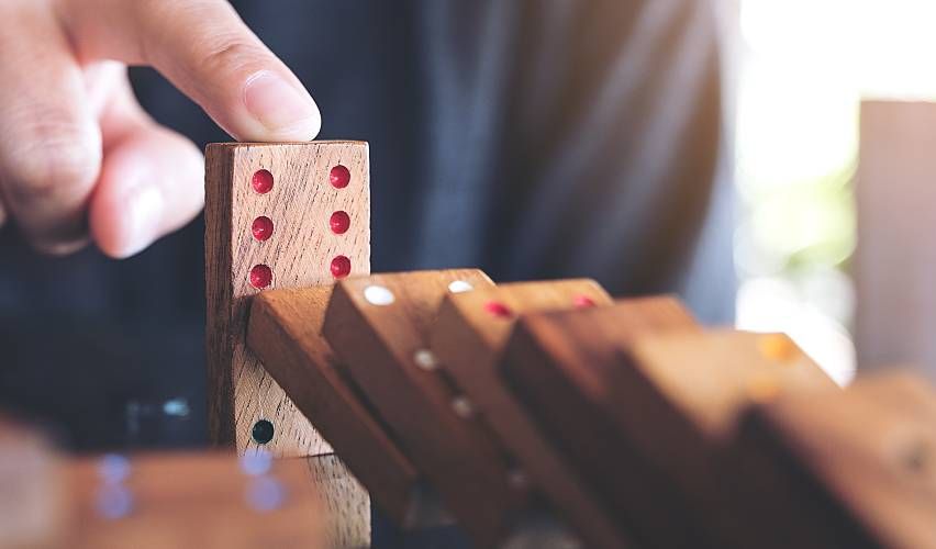 Person playing dominoes.