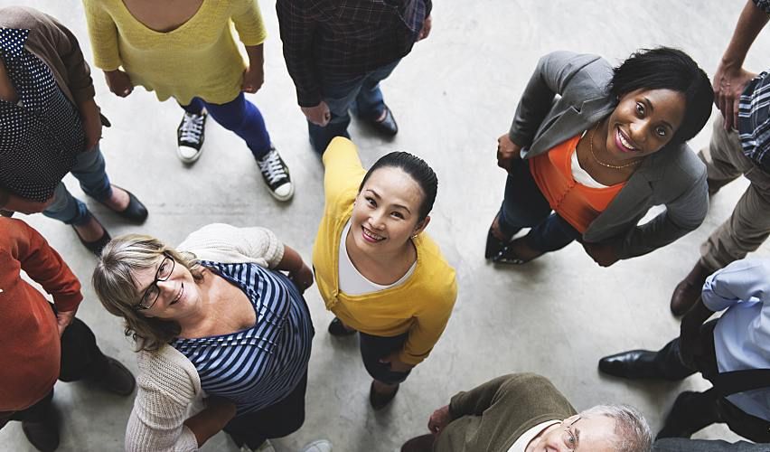 Group of people looking up at the camera.